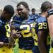 Michigan running back Derrick Green stands with teammates as they wait to have their photo taken at the stadium on Sunday, August 11, 2013. Melanie Maxwell | AnnArbor.com